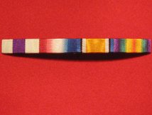 MILITARY CROSS AND 1914 STAR AND BRITISH WAR MEDAL AND VICTORY MEDAL RIBBON SEW ON BAR